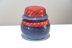 Porcelain lidded jar with etched design, Ruby and Texture Blue glaze combination.