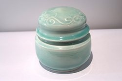 Porcelain lidded candy jar with etched design glazed in Baby Blue Celadon.