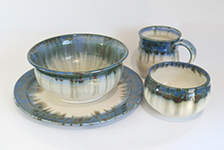 Porcelain plate, bowl, mug, and tea bowl with Midnight Rain and Alabaster glazes
