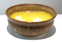 Porcelain bowl with Japanese maple leaf pattern inside with yellow background under clear glaze, Honeycomb glaze on rim and outside of bowl.